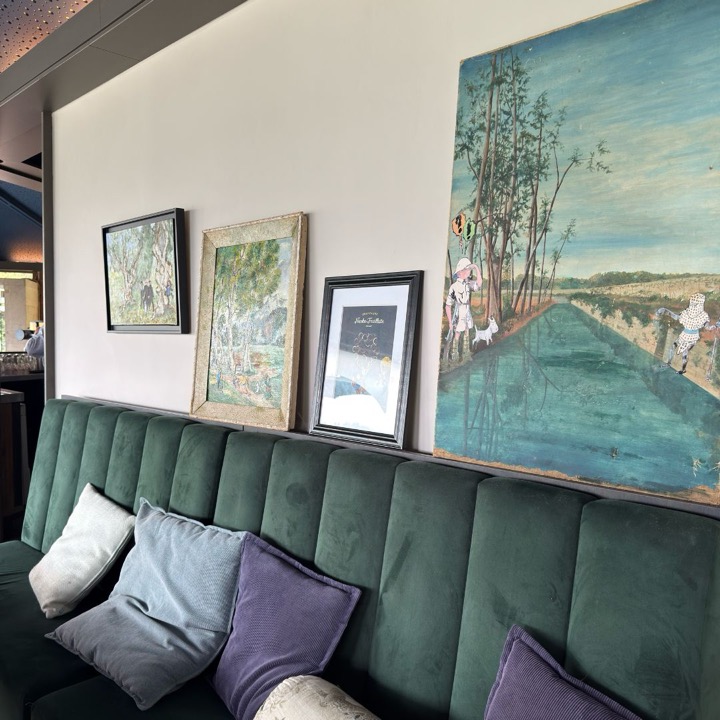 Lounge bench with art on the wall in the restaurant