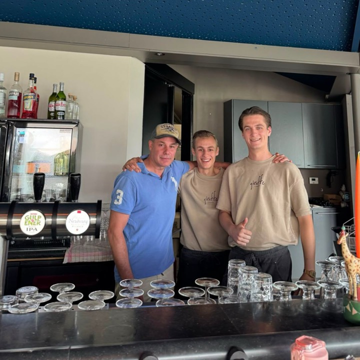 Giraffe Lodge staff behind the bar