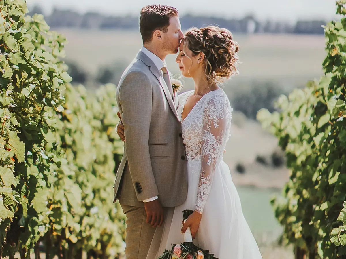 Couple among the vines, wedding organised by FBLS Weddings